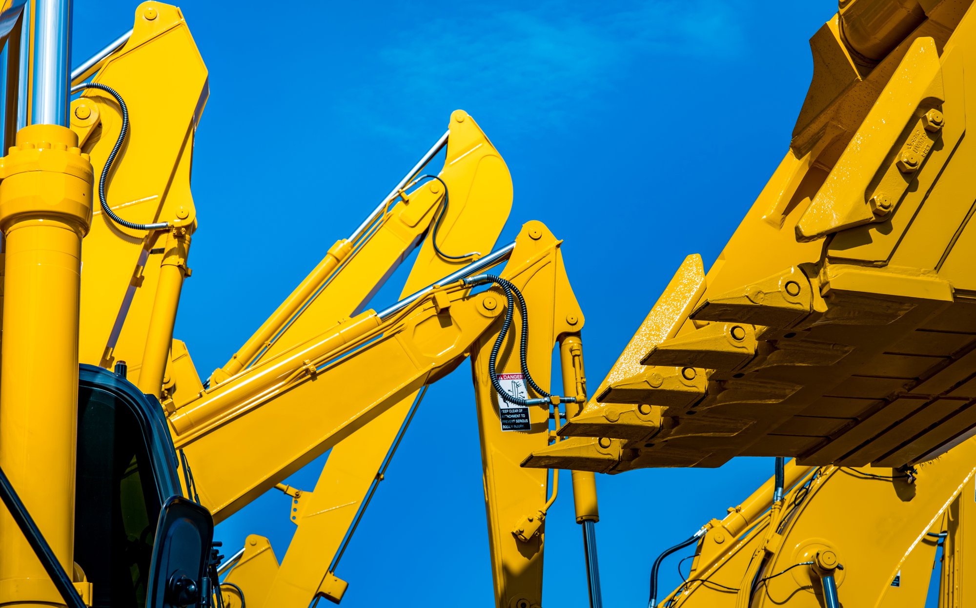 bright-yellow-heavy-equipment-construction-against-2026-01-07-06-47-30-utc bright-yellow-heavy-equipment-construction-against-2026-01-07-06-47-30-utc
